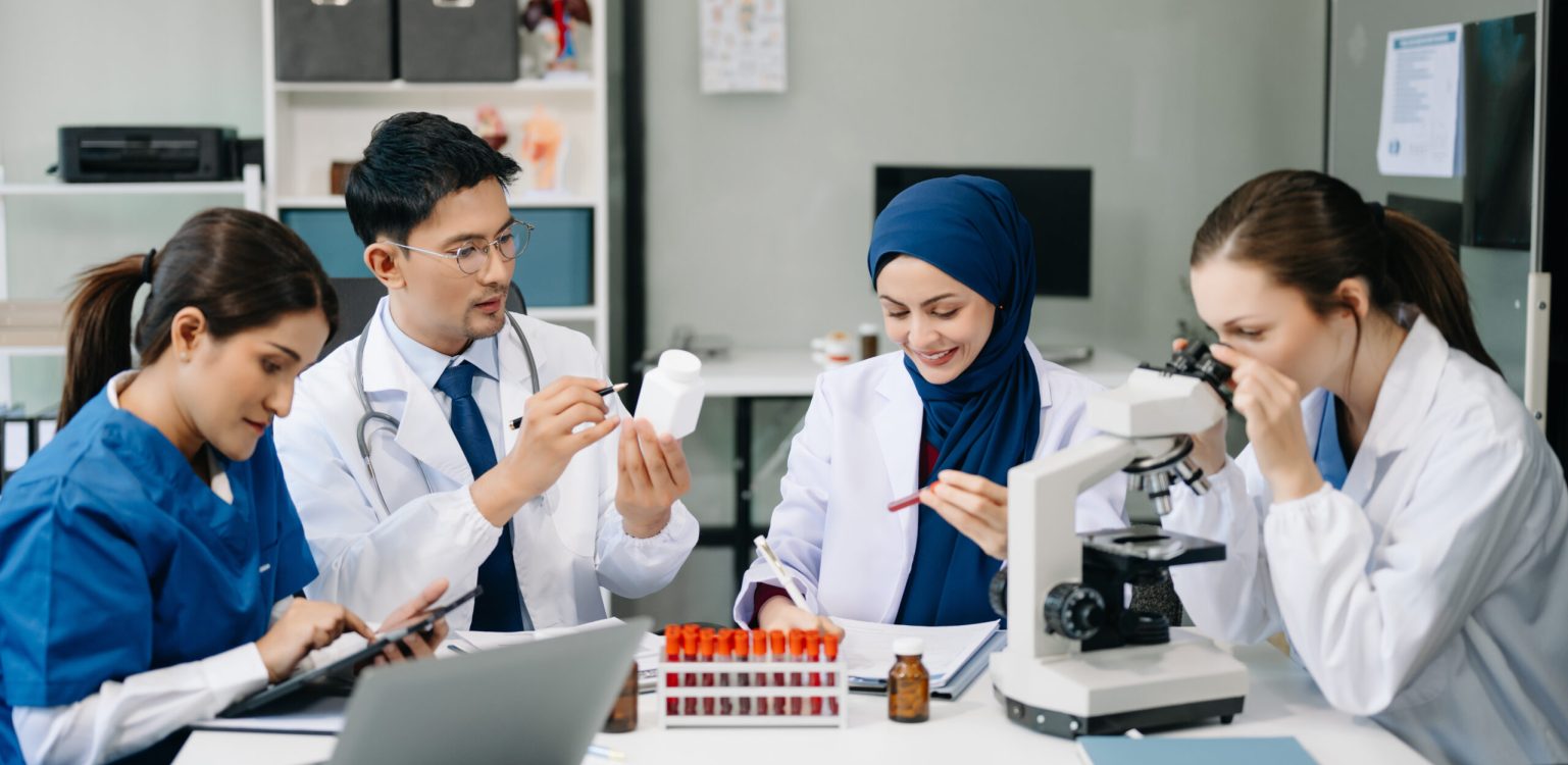 Modern Medical Research Laboratory Portrait of Team Scientists Working, Using Digital Tablet, Analyzing Samples, Talking. for Medicine, Biotechnology Development